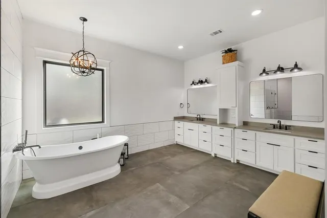 a bathroom with a bathtub and a sink