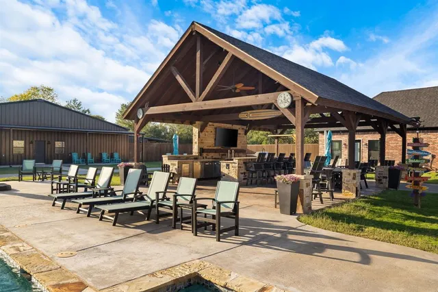 a swimming pool with outdoor seating and yard