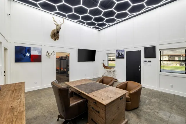 a front view of a house with a garden and yard