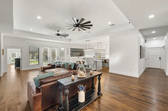 a view of a dining room kitchen with stainless steel appliances granite countertop a stove and a refrigerator