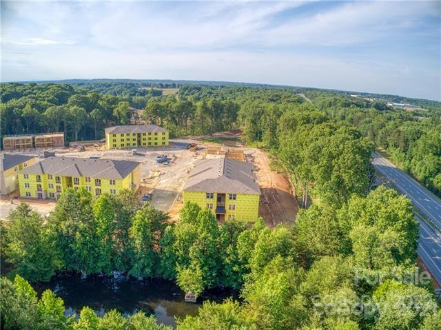 0 Bluefield Road Mooresville, NC 28117 - Photo 2 of 8 a view of a swimming pool with lawn chairs and plants