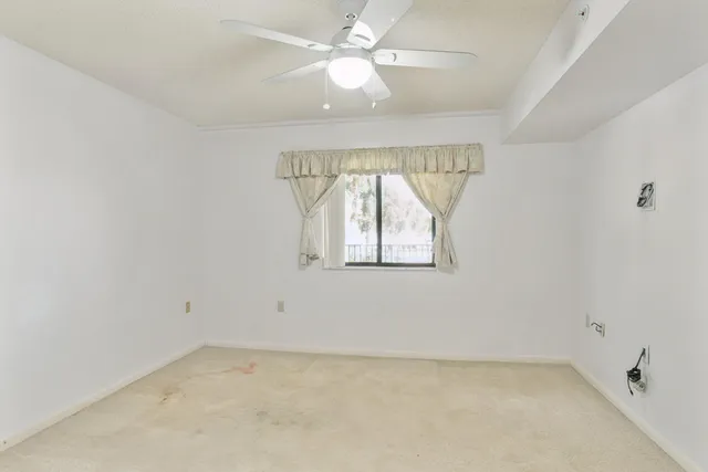 an aerial view of residential building with outdoor space and seating