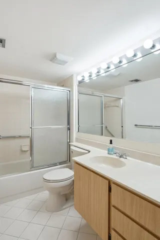 a swimming pool with an outdoor space and seating area