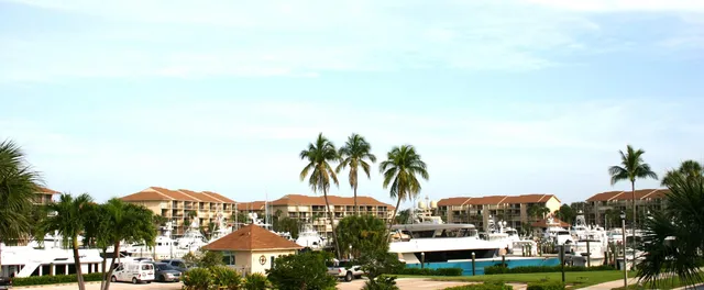 a kitchen with stainless steel appliances granite countertop a sink a stove and a microwave