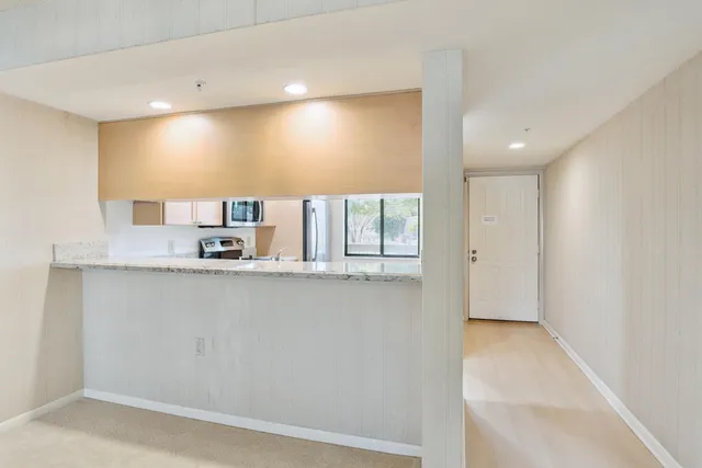 a bathroom with a shower sink and mirror