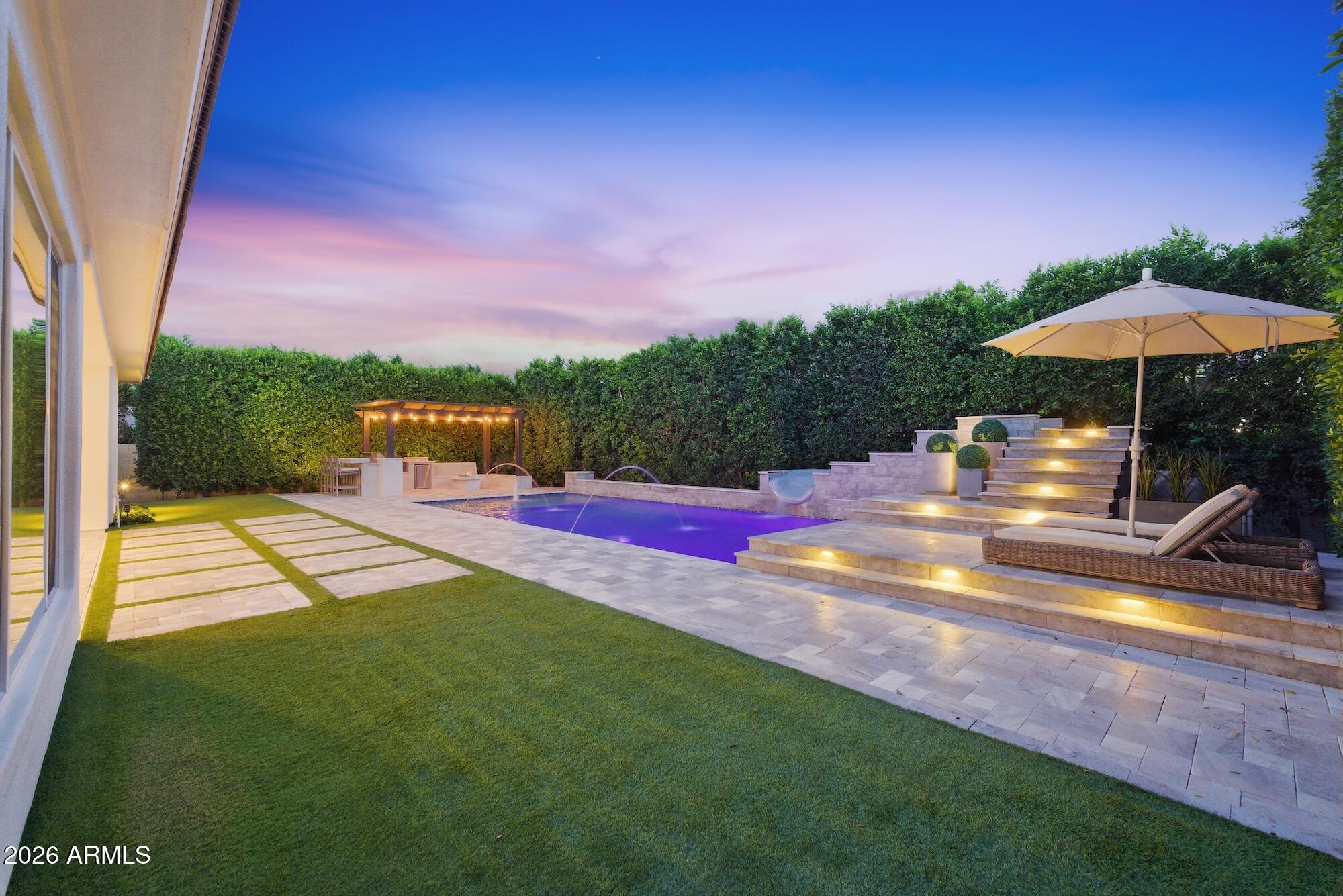 2633 East Geronimo Street Gilbert, AZ 85295 - Photo 4 of 75 a view of a swimming pool with a patio