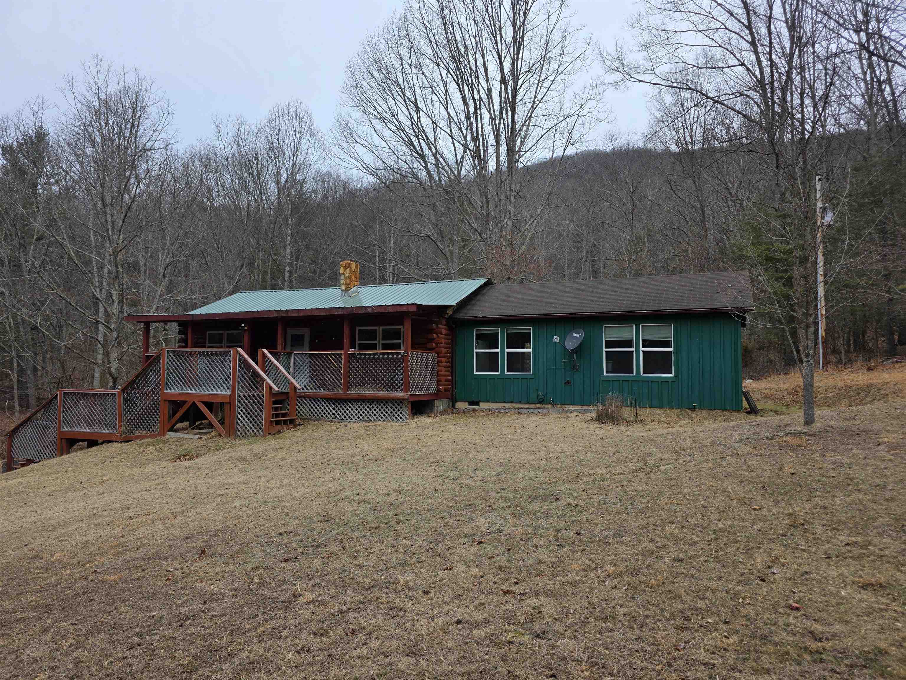 a view of a house with a yard and garage