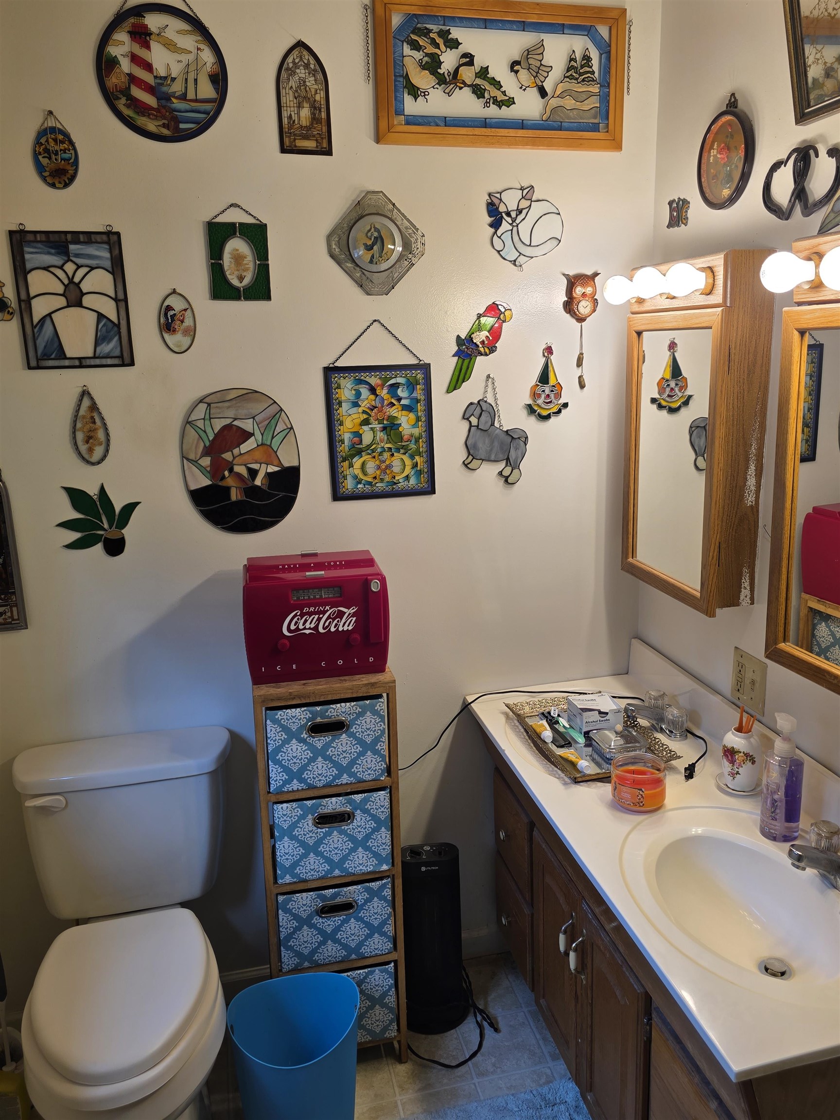 6537 Mill Creek Road Millboro, VA 24460 - Photo 13 of 17 a bathroom with a toilet a sink and a mirror