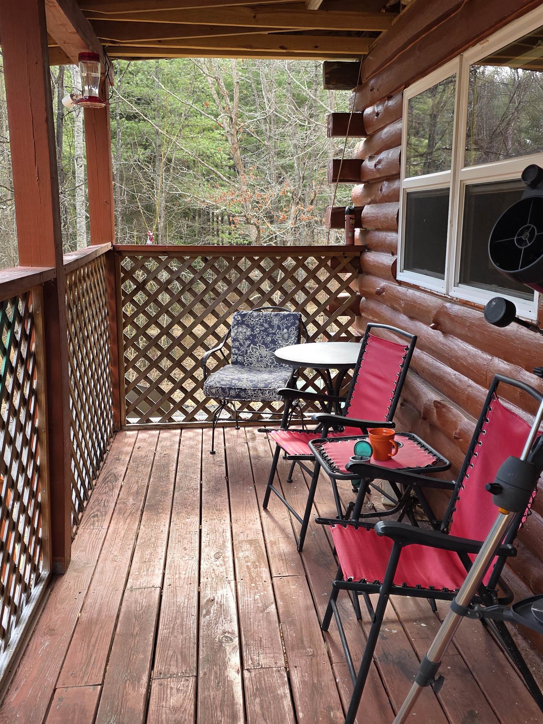 6537 Mill Creek Road Millboro, VA 24460 - Photo 16 of 17 a view of a chairs and table on the deck