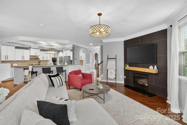 a kitchen with stainless steel appliances granite countertop a sink a stove and cabinets
