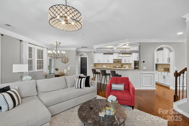 a kitchen with sink cabinets and wooden floor