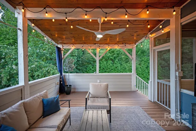 a view of a backyard with a small cabin and a swing chair