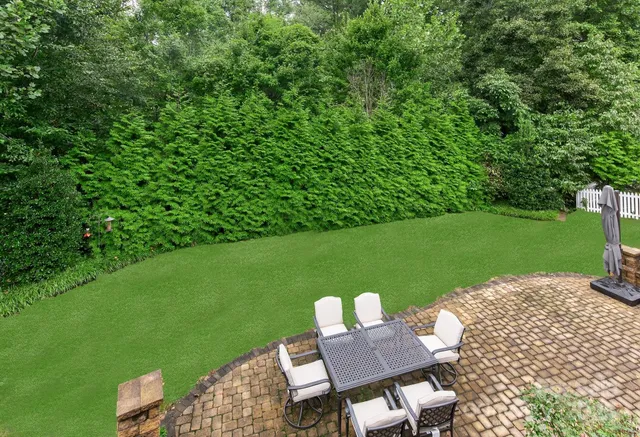 an aerial view of a house with swimming pool