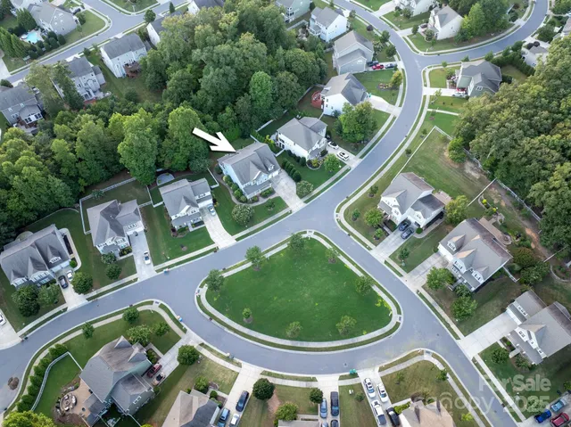 a view of a hallway with entryway wooden floor and front door