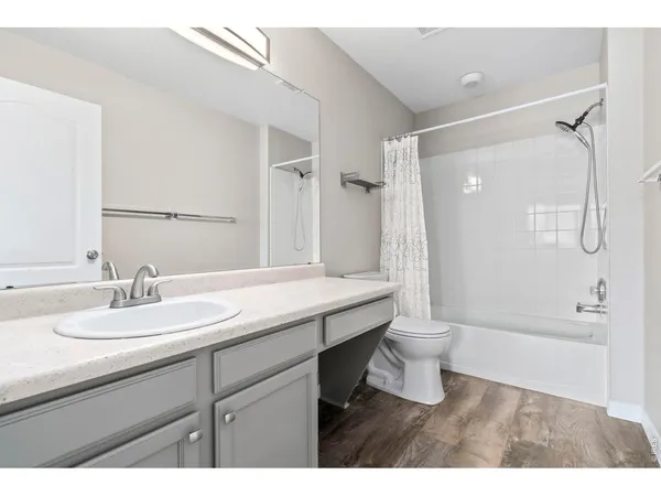 a view of empty room with wooden walls