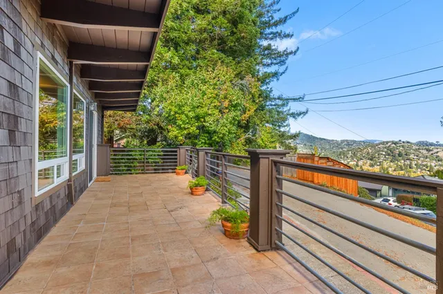 a view of a balcony with chairs