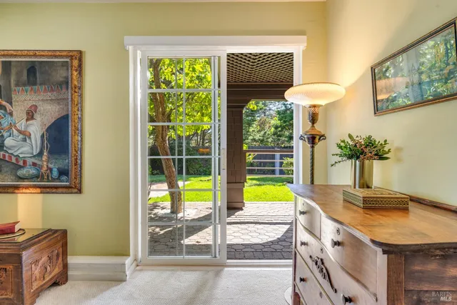 a bathroom with a granite countertop sink and a large mirror
