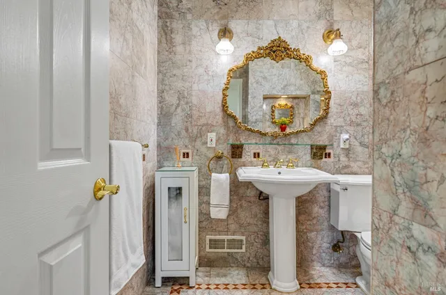 a bathroom with a sink and mirror