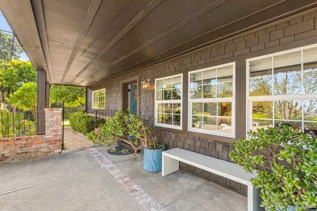 a view of house with a yard