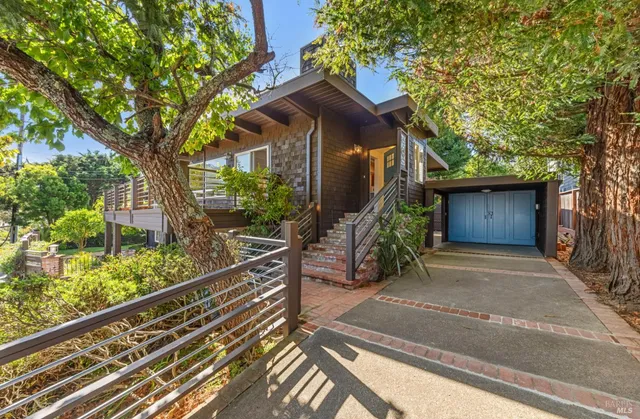 a front view of a house with garden