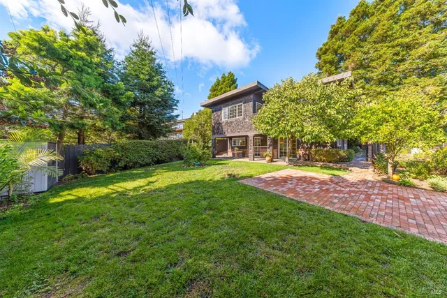 a view of yard with swimming pool and green space