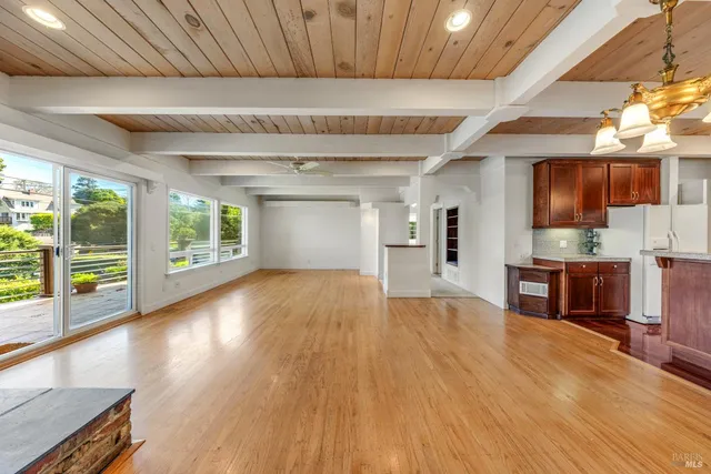 a view of kitchen with furniture and wooden floor