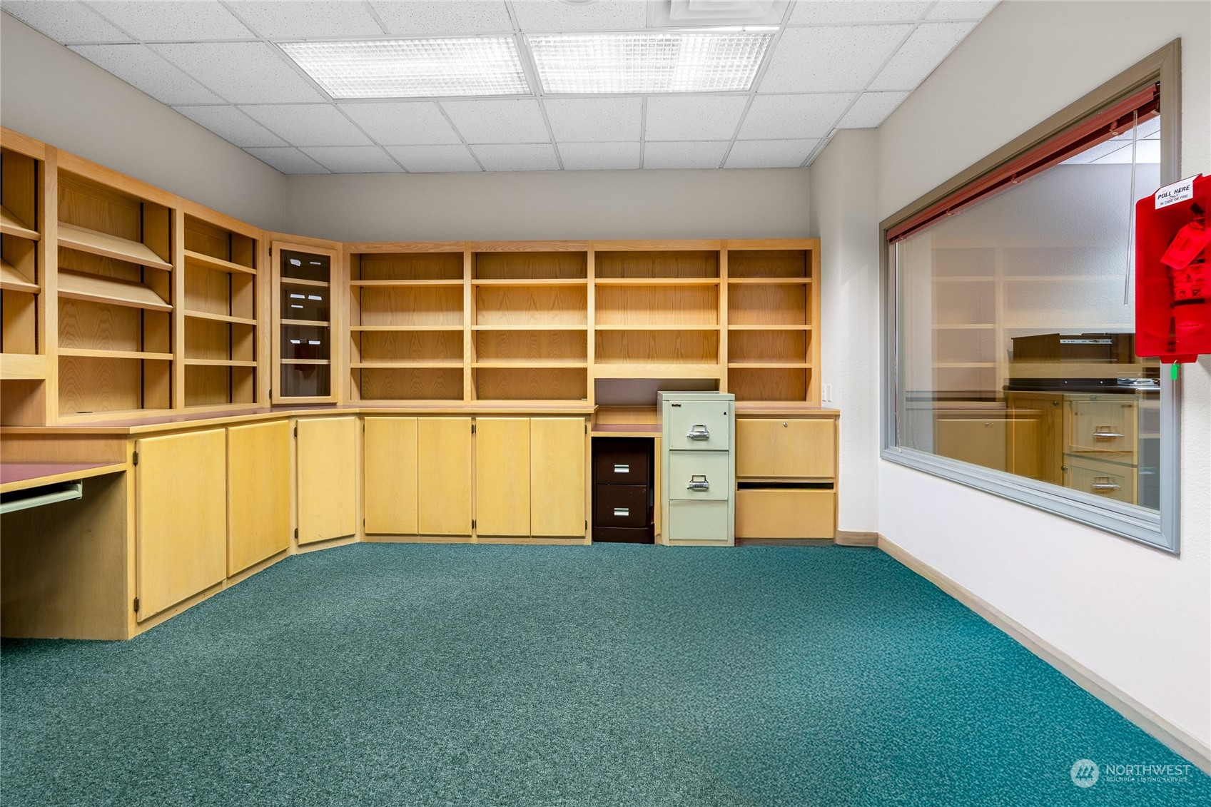 804 North State Street Tacoma, WA 98403 - Photo 14 of 36 a view of an empty room with a fireplace and a window