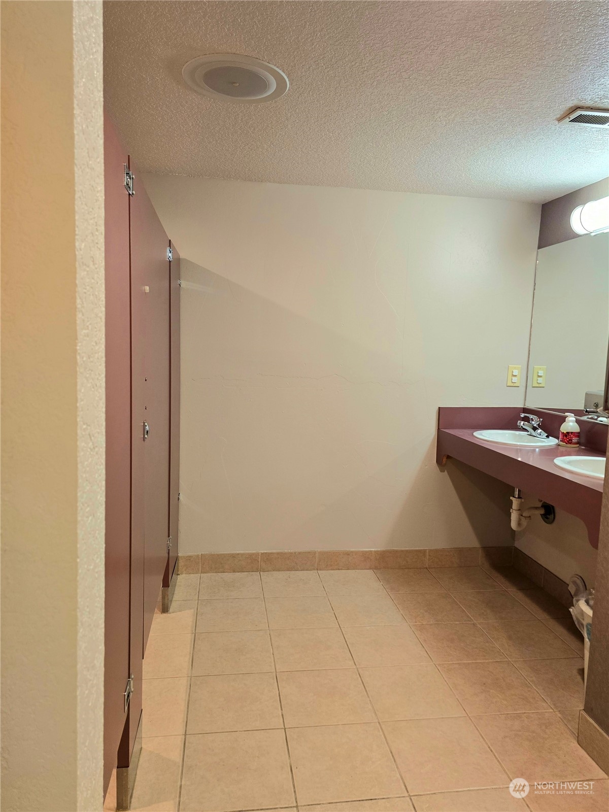 804 North State Street Tacoma, WA 98403 - Photo 23 of 36 a room with a sink and a mirror