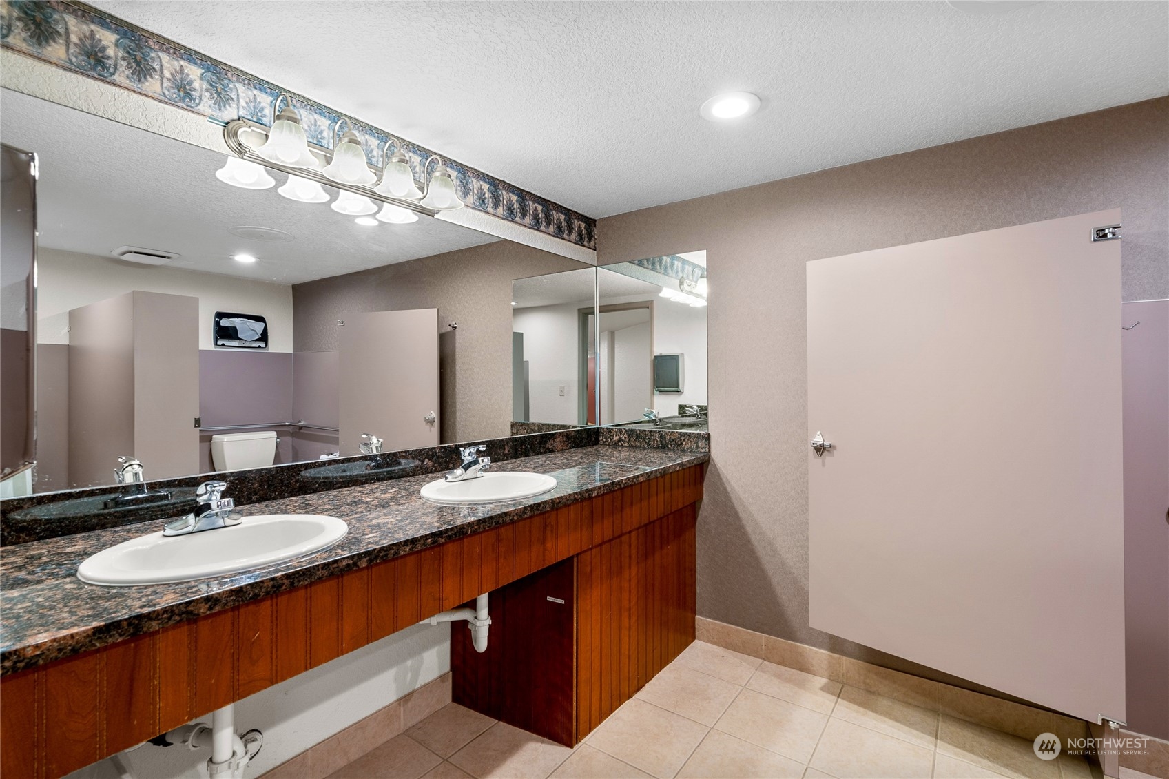 804 North State Street Tacoma, WA 98403 - Photo 27 of 36 a bathroom with a granite countertop sink and a mirror