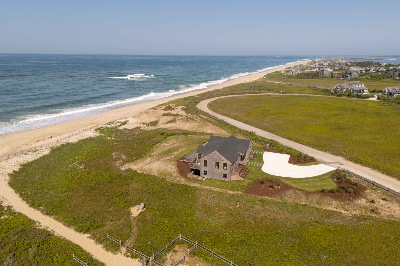 37 Starbuck Road Nantucket, MA 02554 - Photo 2 of 24 a view of an ocean from a balcony
