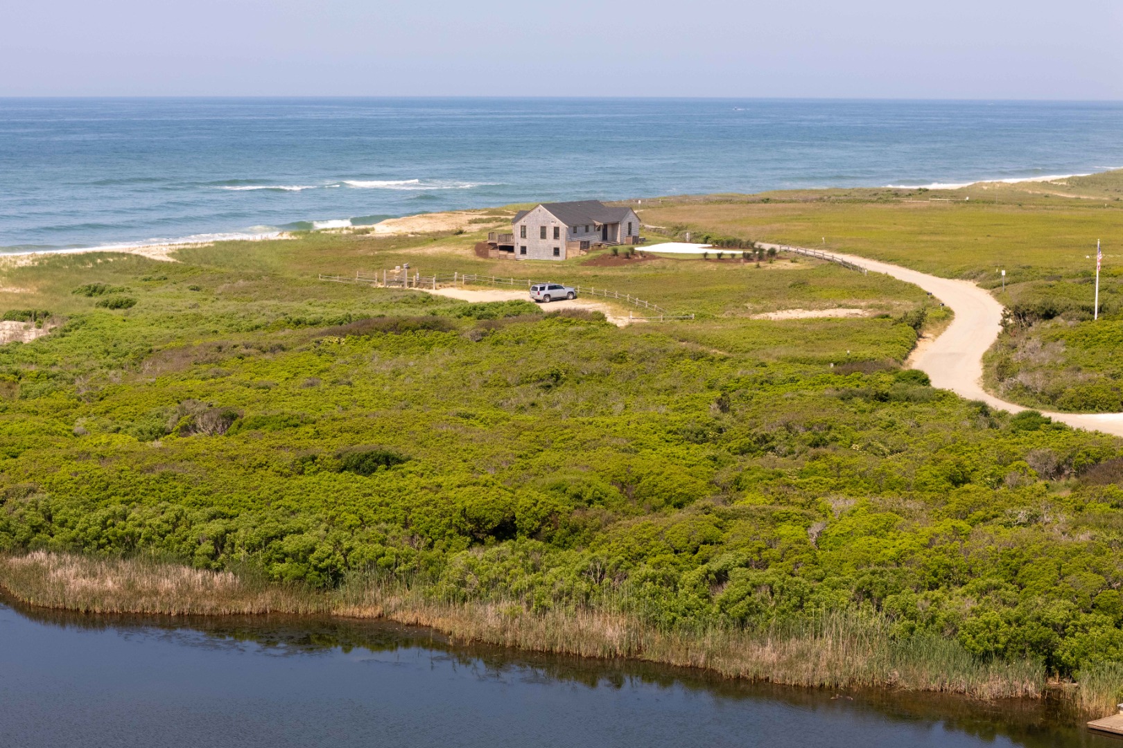 37 Starbuck Road Nantucket, MA 02554 - Photo 4 of 24 a view of an ocean from a yard