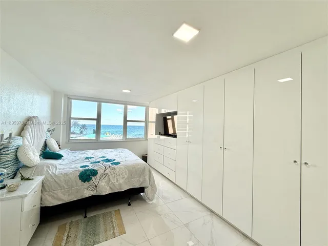 a en suite bathroom with a sink and a mirror