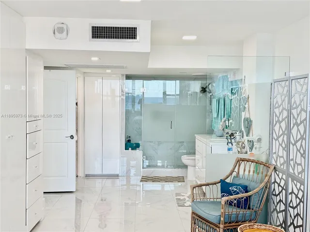 a room with a cabinets and a window