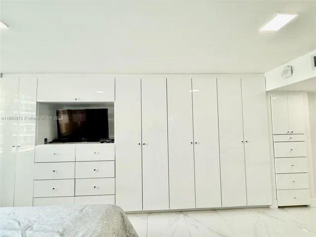 a swimming pool with outdoor seating and yard