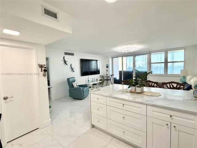 a spacious bathroom with a double vanity sink a mirror and a shower