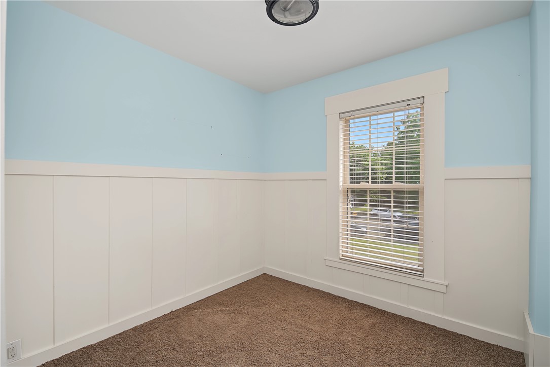 8707 Lytle Ferry Road Waynesville, OH 45068 - Photo 24 of 54 Board and batten wainscoting adds character to this adaptable room, illuminated by a broad window.