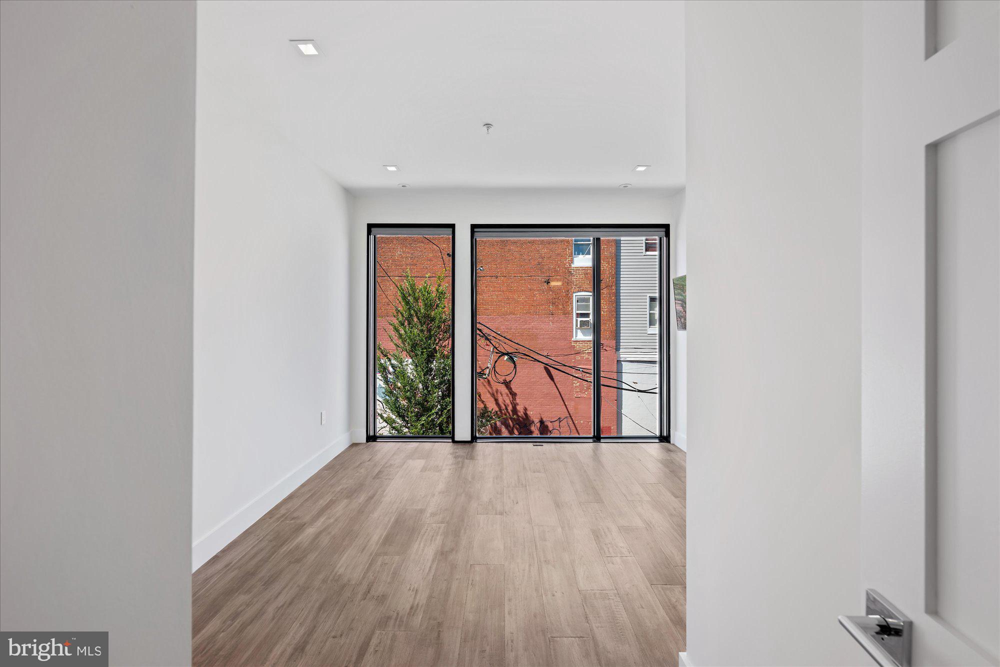 1777 T Street Northwest, Unit 5 Washington, DC 20009 - Photo 23 of 48 a view of a room with wooden floor and a window