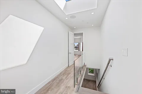 a view of staircase with white walls and stairs