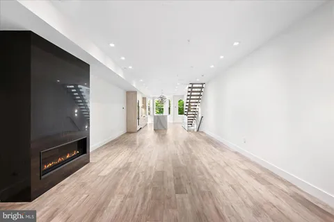 a view of a room with wooden floor