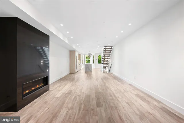 a view of a room with wooden floor
