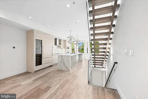 a view of wooden floor and windows in a room