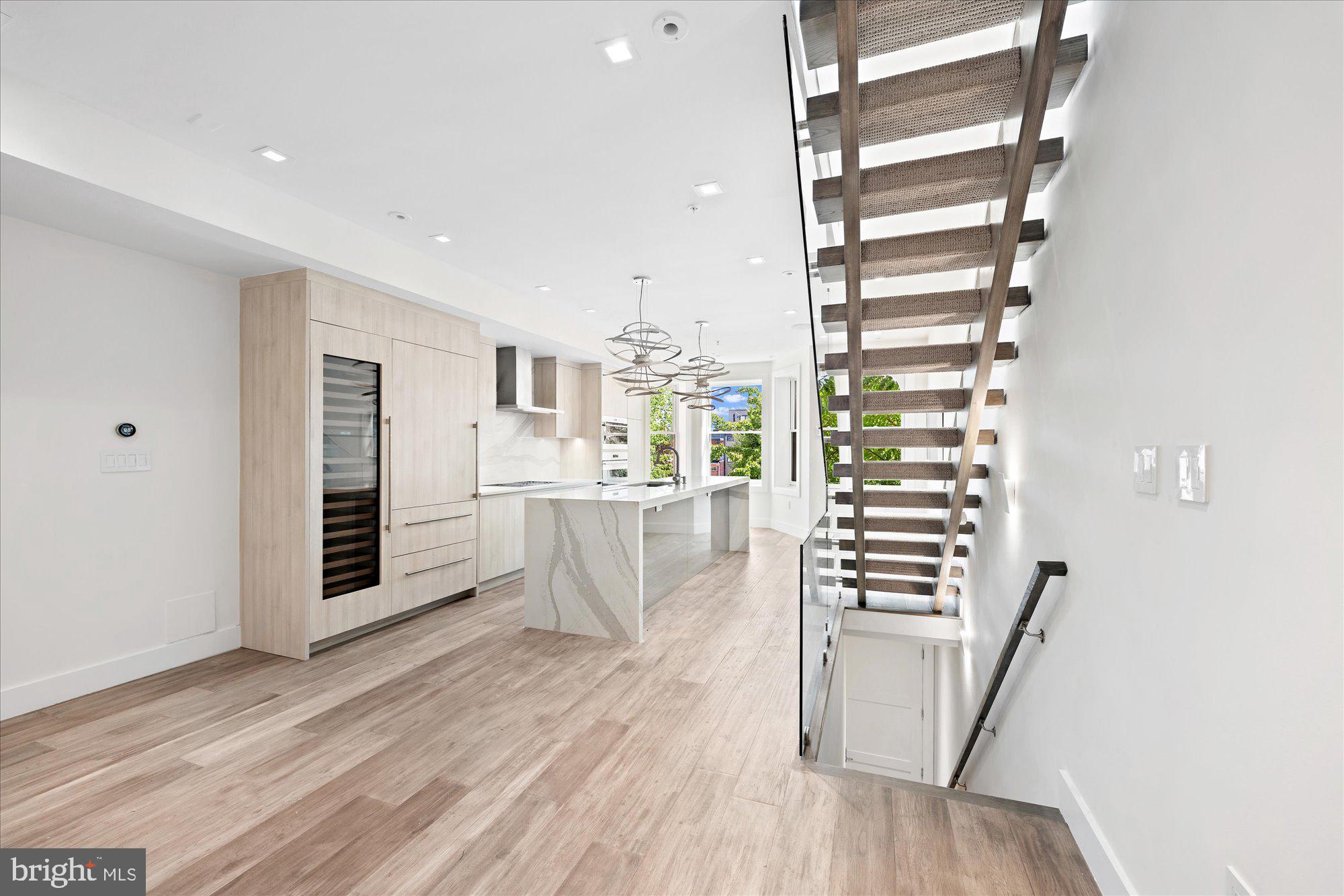 1777 T Street Northwest, Unit 5 Washington, DC 20009 - Photo 8 of 48 a view of wooden floor and windows in a room