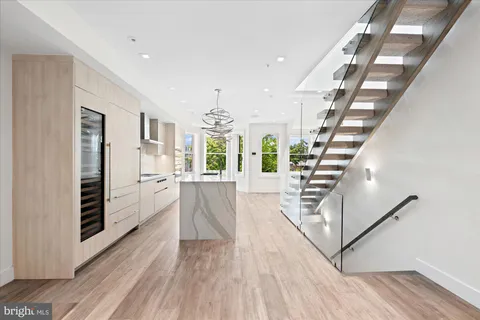 a view of entryway with wooden floor and stairs