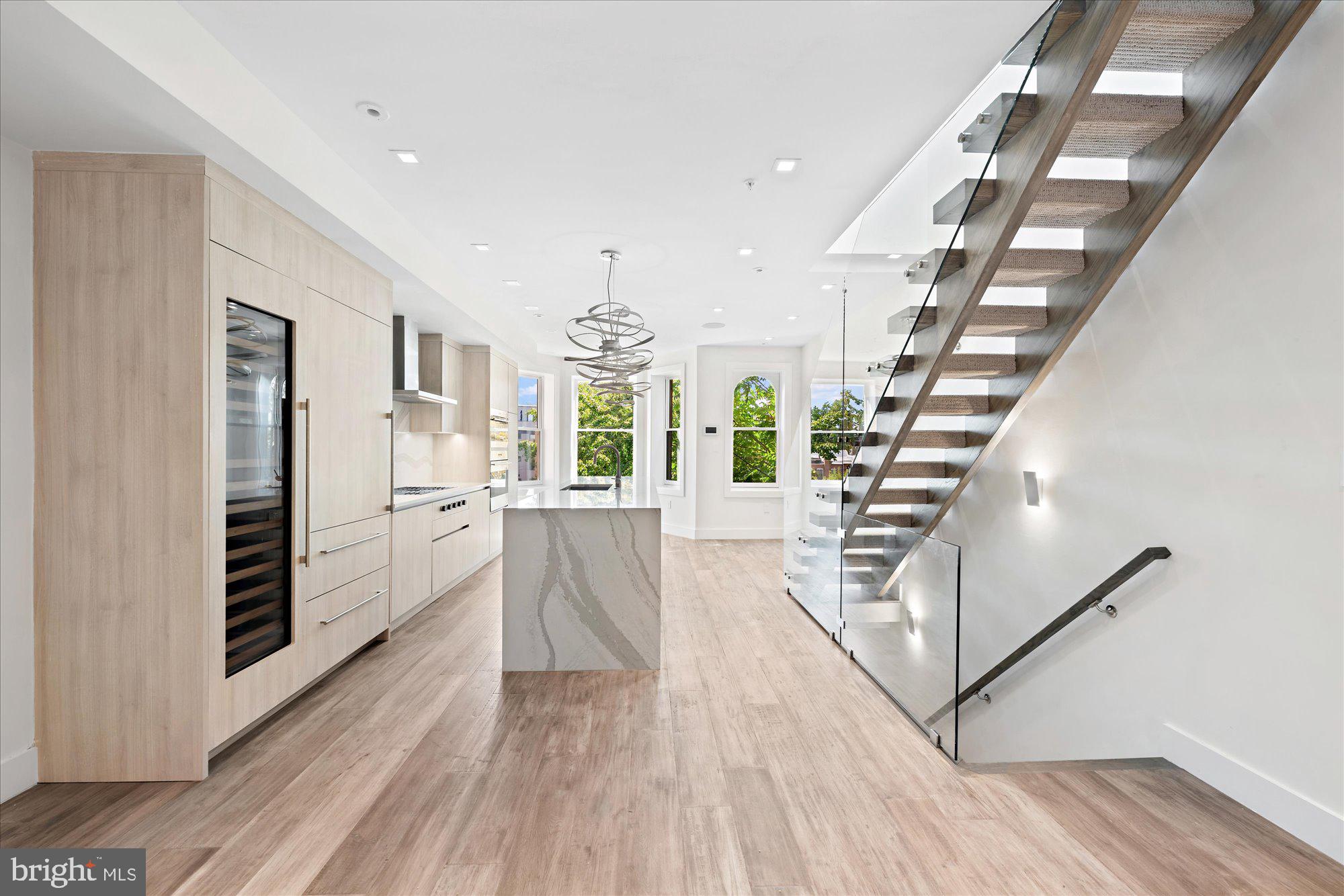 1777 T Street Northwest, Unit 5 Washington, DC 20009 - Photo 9 of 48 a view of entryway with wooden floor and stairs