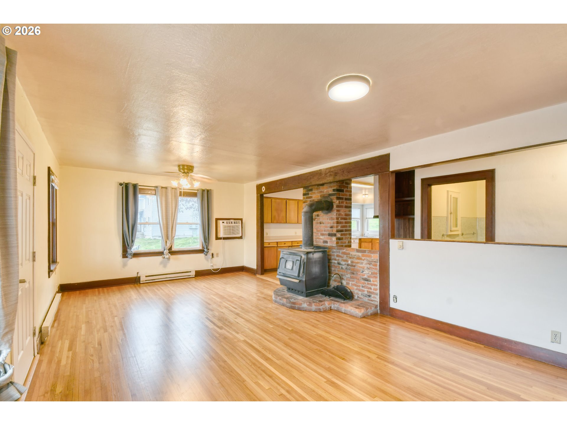 1716 Southeast Court Avenue Pendleton, OR 97801 - Photo 11 of 43 a view of an empty room with wooden floor and a window