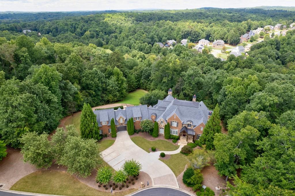 an aerial view of a house with a garden