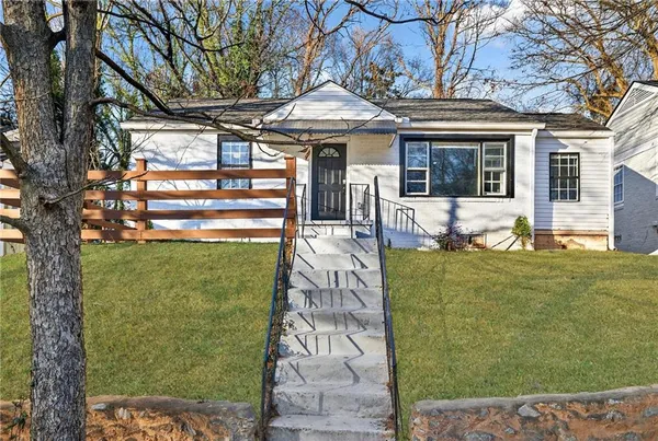 front view of a house with a yard