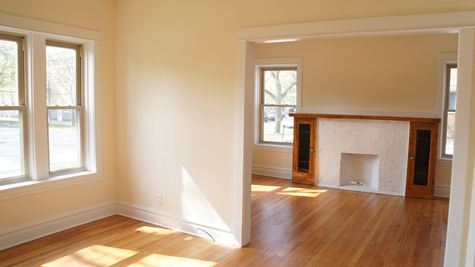 2921 West George Street, Unit 1 Chicago, IL 60618 - Photo 4 of 6 a view of empty room with wooden floor and fan