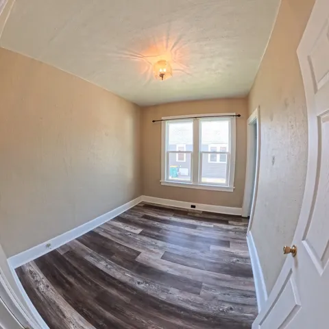 a view of an empty room and window