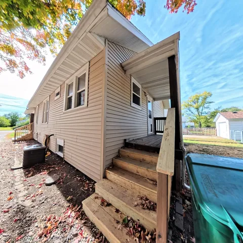 a view of a backyard with sitting area